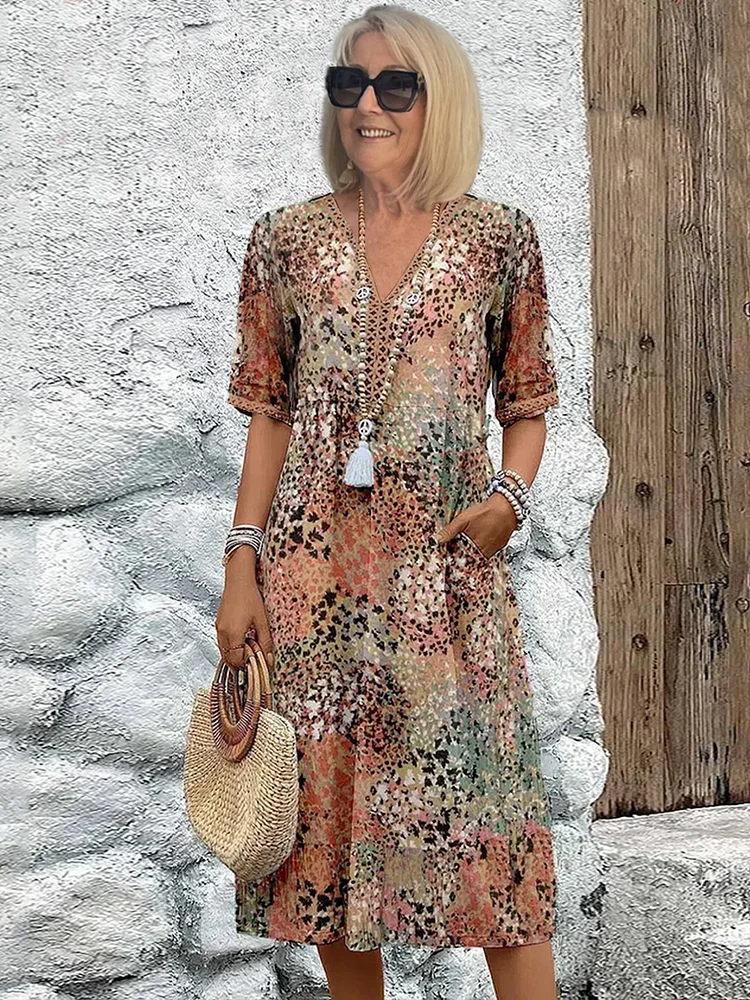 SUSAN | ABITO MIDI DALLA TONALITÀ VIVACE CON ELEGANTE COPERTURA DEL VENTRE