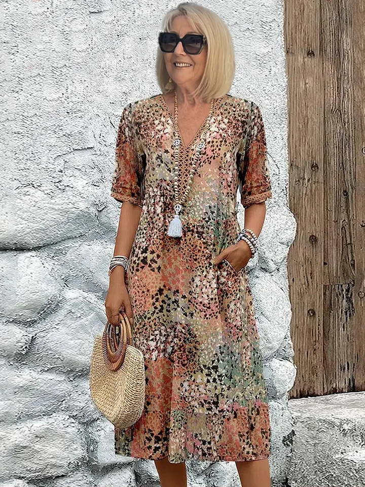 SUSAN | ABITO MIDI DALLA TONALITÀ VIVACE CON ELEGANTE COPERTURA DEL VENTRE