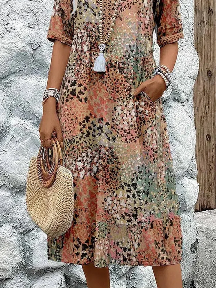 SUSAN | ABITO MIDI DALLA TONALITÀ VIVACE CON ELEGANTE COPERTURA DEL VENTRE