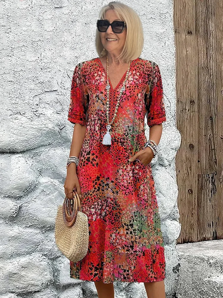 SUSAN | ABITO MIDI DALLA TONALITÀ VIVACE CON ELEGANTE COPERTURA DEL VENTRE