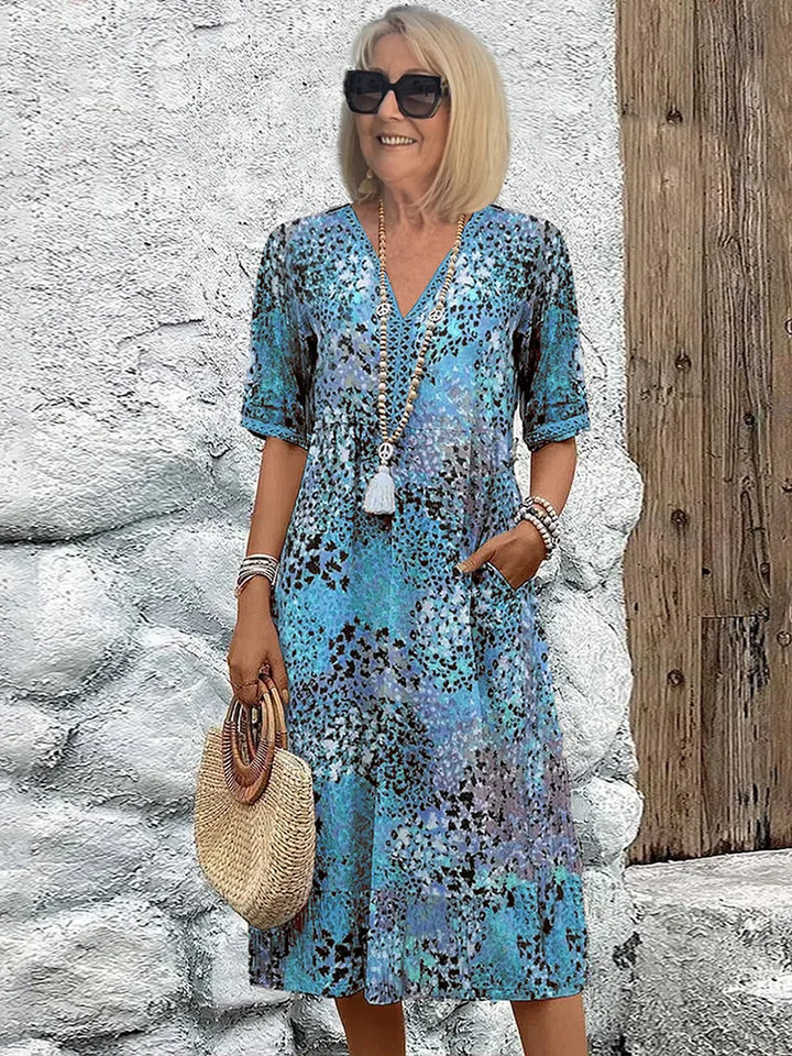 SUSAN | ABITO MIDI DALLA TONALITÀ VIVACE CON ELEGANTE COPERTURA DEL VENTRE