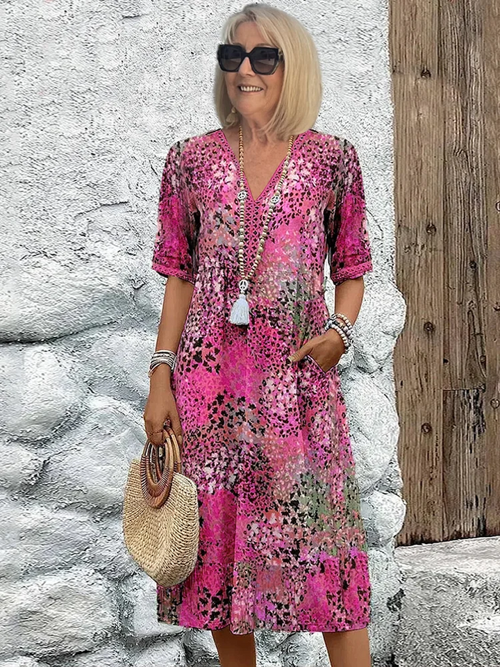 SUSAN | ABITO MIDI DALLA TONALITÀ VIVACE CON ELEGANTE COPERTURA DEL VENTRE